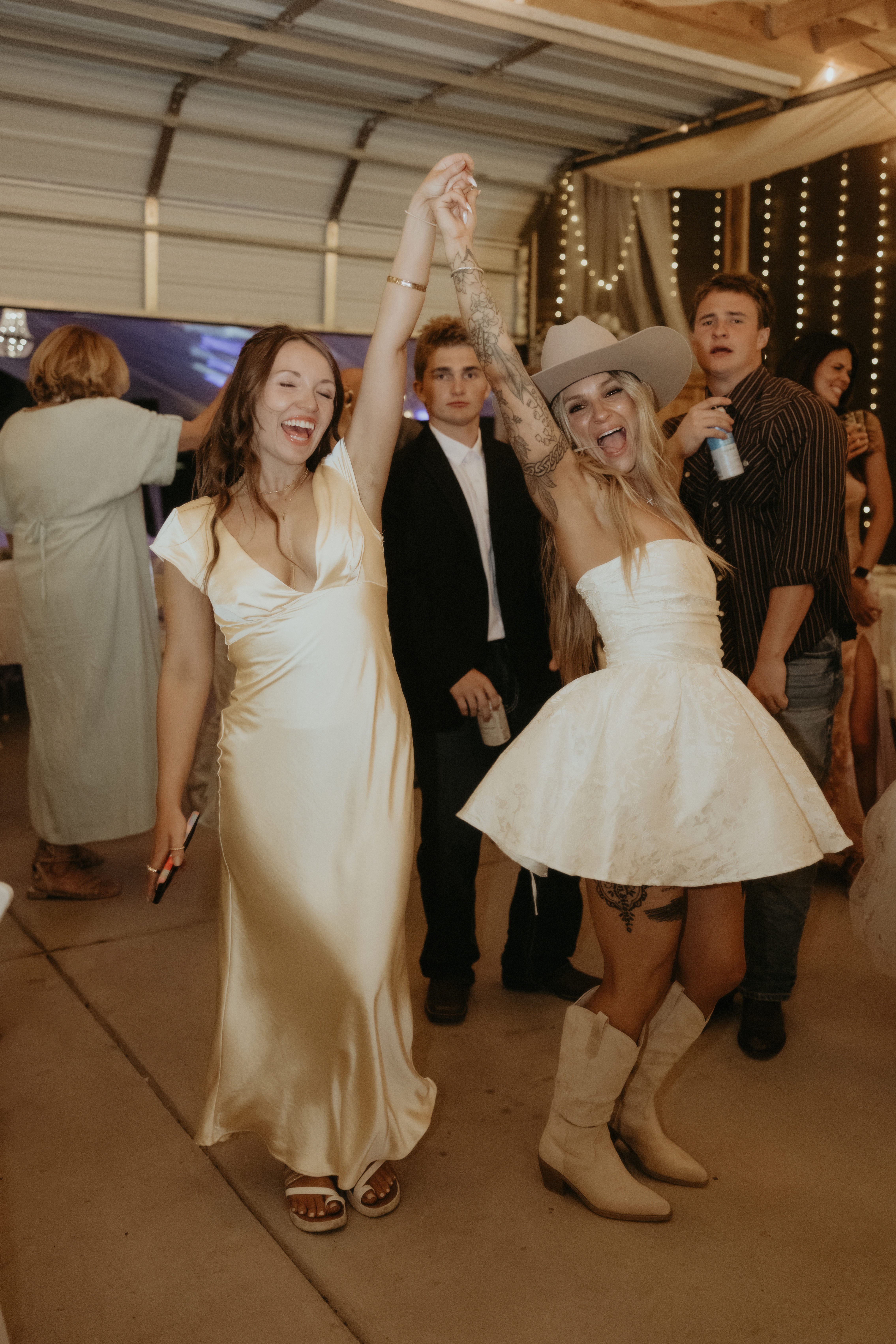 Clients celebrating on the dance floor with radiant event tans